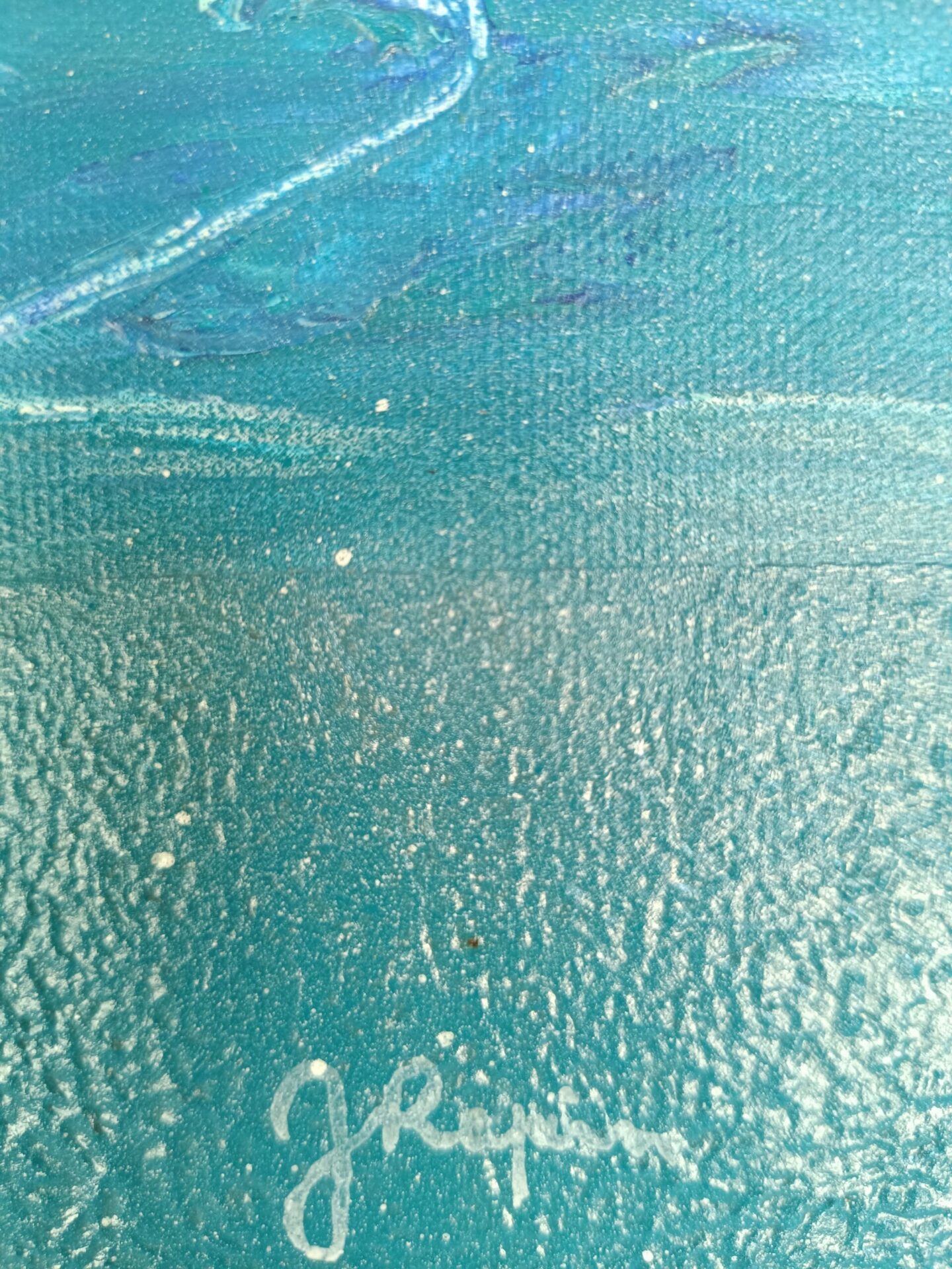 Zoom sur la signature manuscrite de Jocelyne Malek apposée sur en dessous d’une bande bleu marine.
